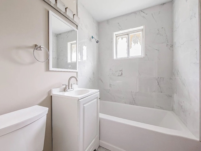 full bath featuring toilet, vanity, and bathing tub / shower combination