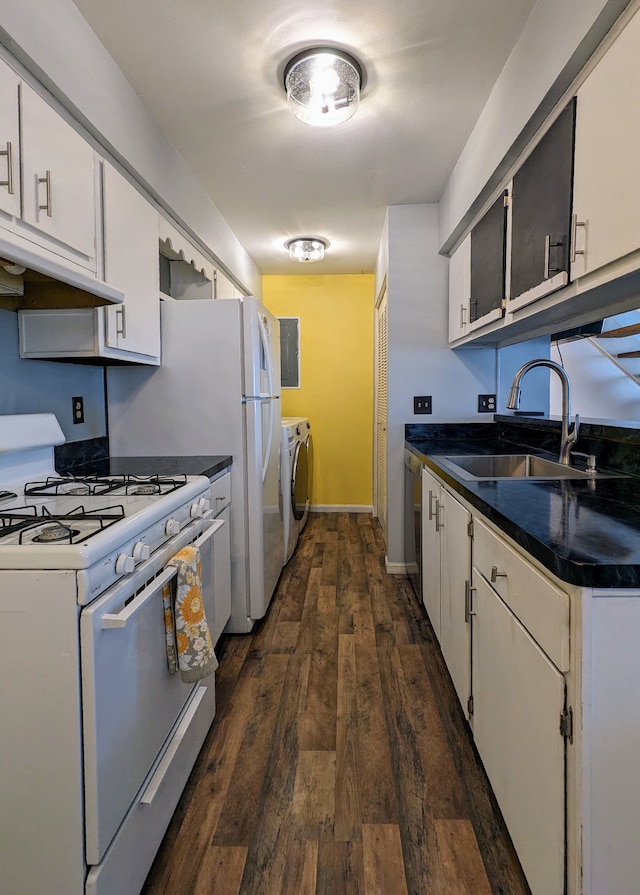 kitchen featuring dark wood finished floors, gas range gas stove, stainless steel dishwasher, a sink, and under cabinet range hood