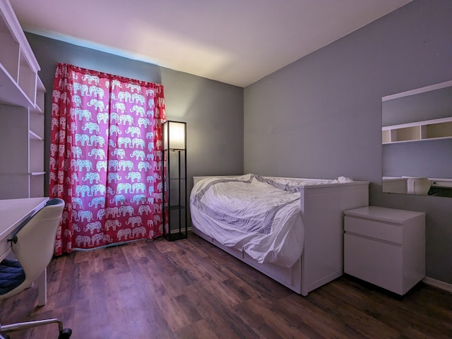 bedroom with wood finished floors