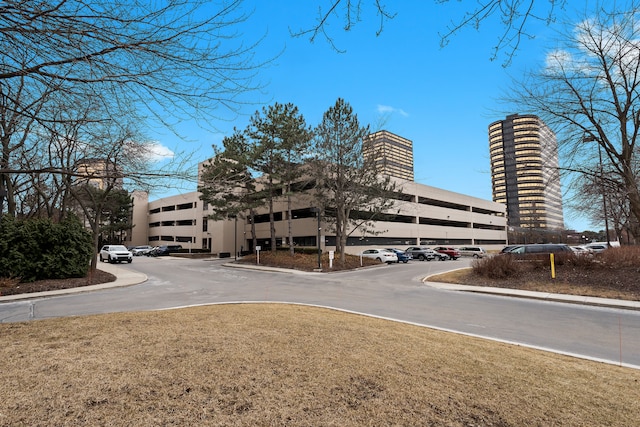 view of property with uncovered parking