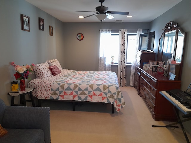 bedroom with ceiling fan, recessed lighting, visible vents, and light colored carpet