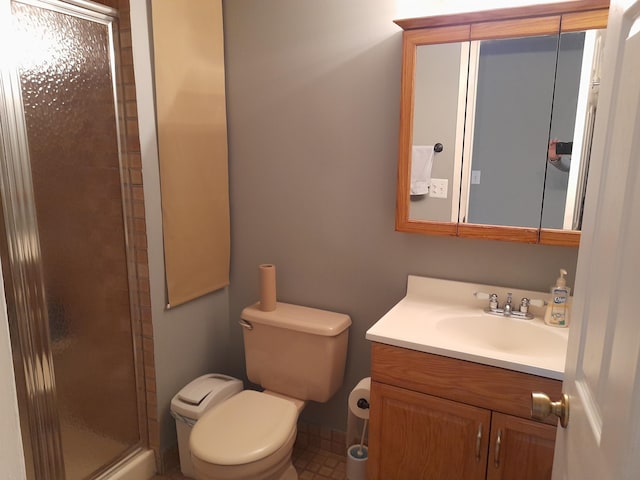 full bath featuring a shower stall, toilet, and vanity