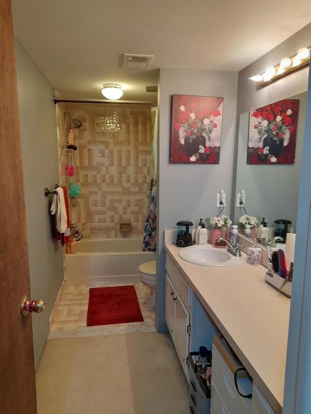 bathroom featuring toilet, shower / tub combo, vanity, and visible vents