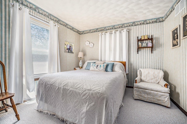 carpeted bedroom featuring wallpapered walls