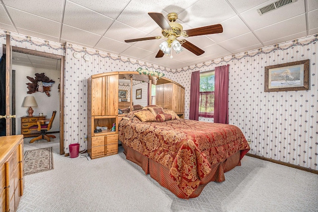 bedroom featuring carpet flooring, visible vents, and wallpapered walls