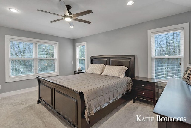 bedroom with a ceiling fan, recessed lighting, light colored carpet, and baseboards