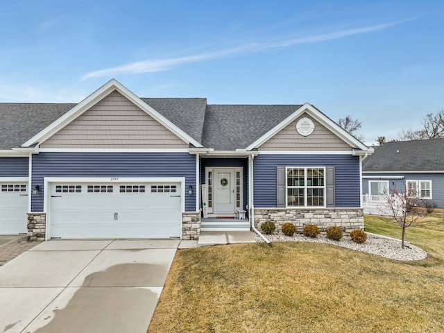 craftsman inspired home with concrete driveway, stone siding, roof with shingles, an attached garage, and a front lawn