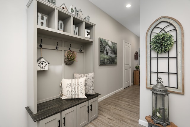 mudroom featuring light wood-style floors, baseboards, and recessed lighting