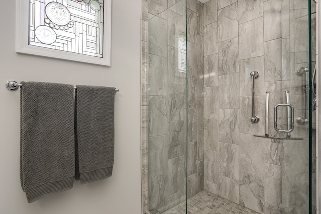 full bathroom featuring a shower stall