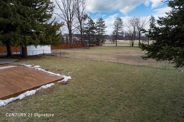 view of yard with a deck and fence