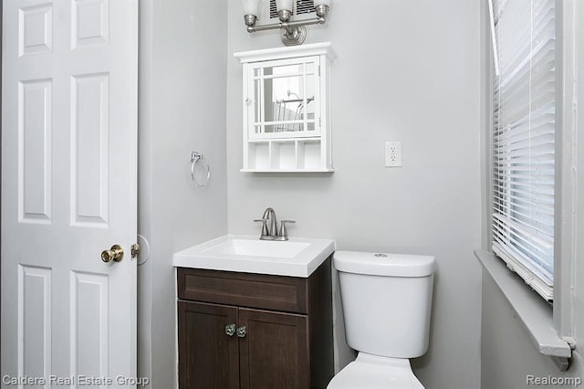 bathroom with vanity and toilet