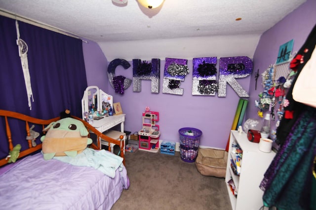 carpeted bedroom featuring a textured ceiling