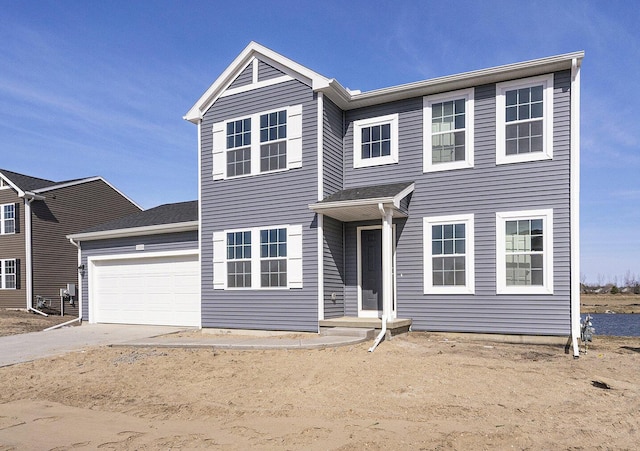 traditional-style home with a garage and driveway