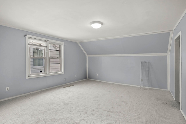 bonus room featuring lofted ceiling and carpet