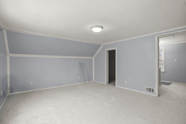 bonus room featuring vaulted ceiling, carpet floors, visible vents, and baseboards