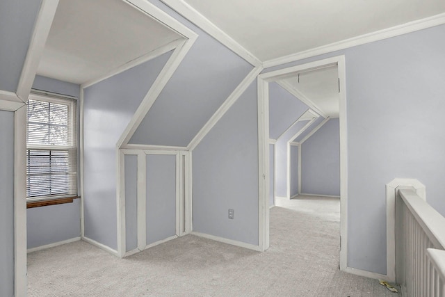 additional living space featuring carpet floors and baseboards