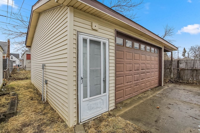 view of outbuilding with fence and an outdoor structure