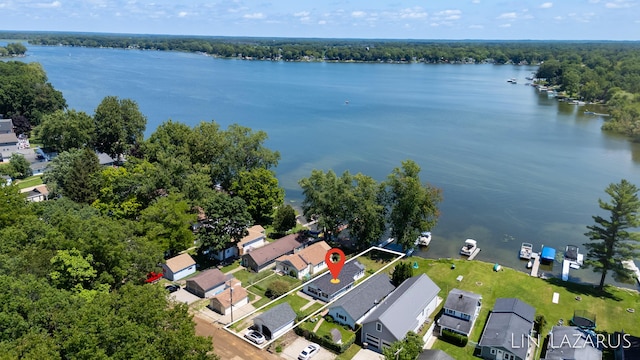 bird's eye view featuring a residential view and a water view