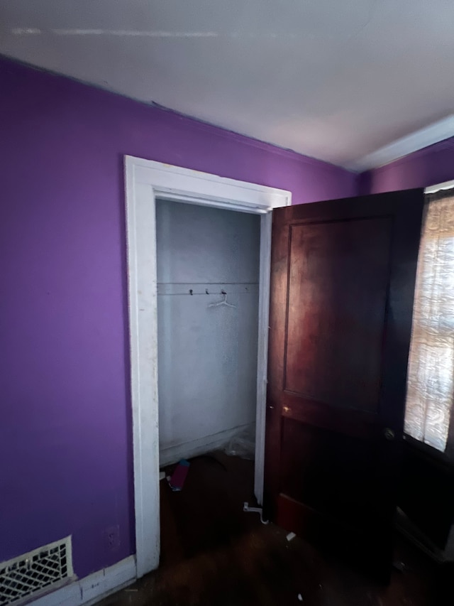 3674 Mount Elliott St, Detroit, MI 48207 - unfurnished bedroom featuring visible vents and a closet