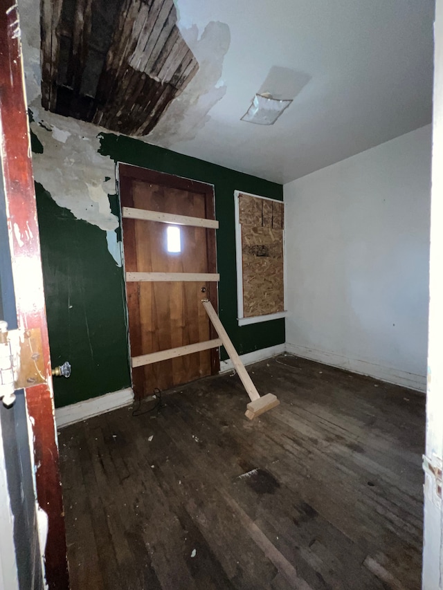3674 Mount Elliott St, Detroit, MI 48207 - unfurnished bedroom with baseboards and wood finished floors
