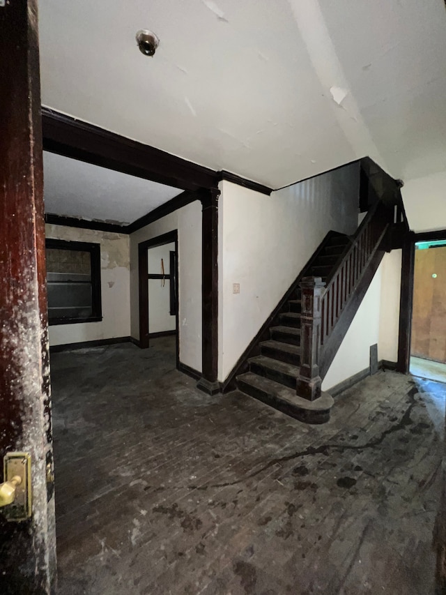 3674 Mount Elliott St, Detroit, MI 48207 - unfurnished living room with baseboards and stairway
