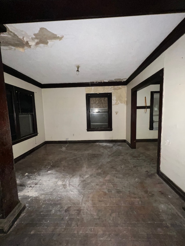 3674 Mount Elliott St, Detroit, MI 48207 - empty room with baseboards, ornamental molding, and concrete flooring