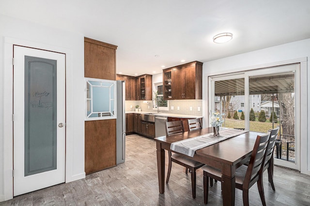 dining space featuring recessed lighting and light wood-style floors