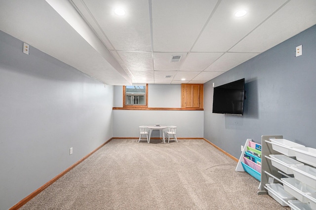 rec room with a drop ceiling, recessed lighting, visible vents, baseboards, and carpet