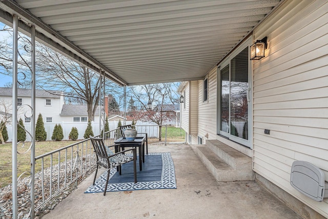 view of patio featuring fence