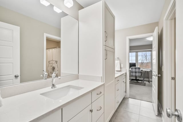 full bath with vanity and tile patterned floors