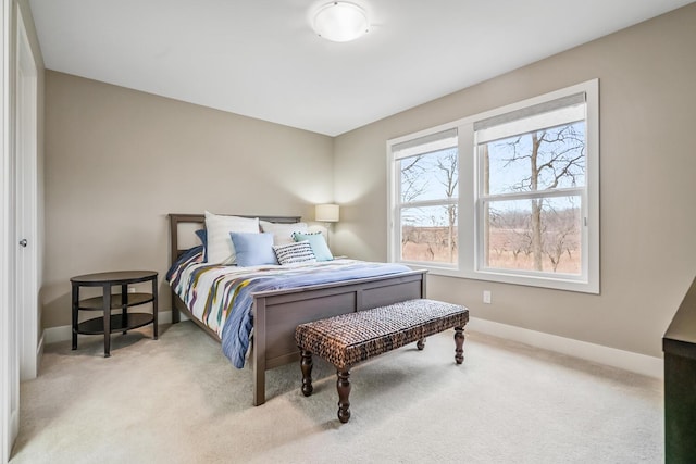 bedroom featuring carpet flooring and baseboards