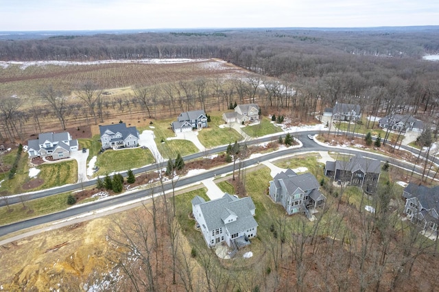 bird's eye view with a residential view and a view of trees