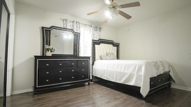 bedroom featuring ceiling fan, wood finished floors, and baseboards