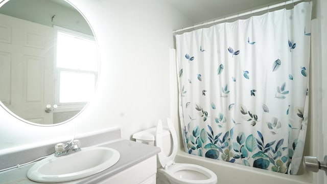 bathroom with toilet, shower / tub combo, and vanity