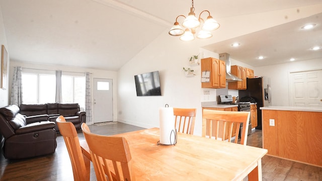 dining space featuring baseboards, lofted ceiling, wood finished floors, a notable chandelier, and recessed lighting