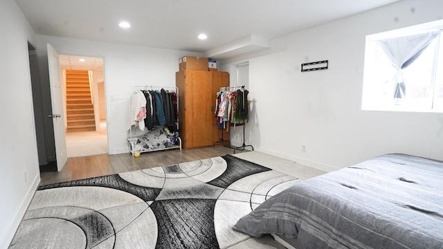 bedroom featuring recessed lighting, baseboards, and wood finished floors