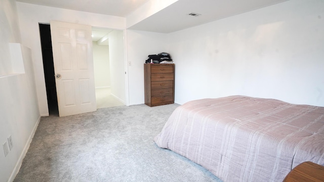 carpeted bedroom with visible vents