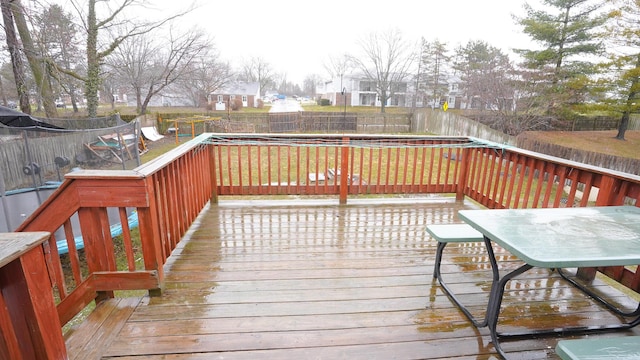 deck with a fenced backyard