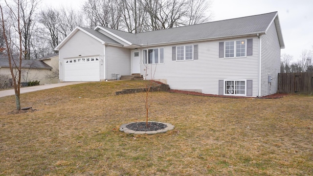 ranch-style house with a garage, a front yard, fence, and driveway