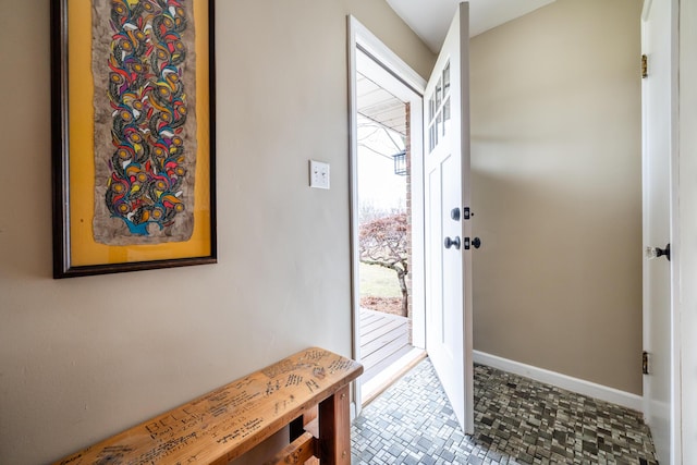 entryway featuring baseboards