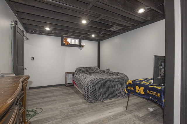 bedroom featuring wood finished floors