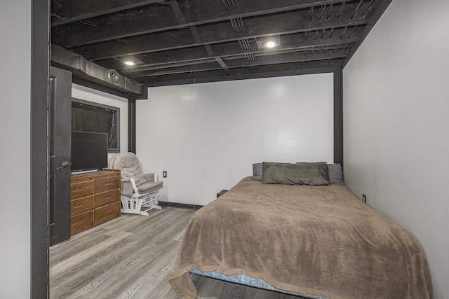 bedroom with wood finished floors