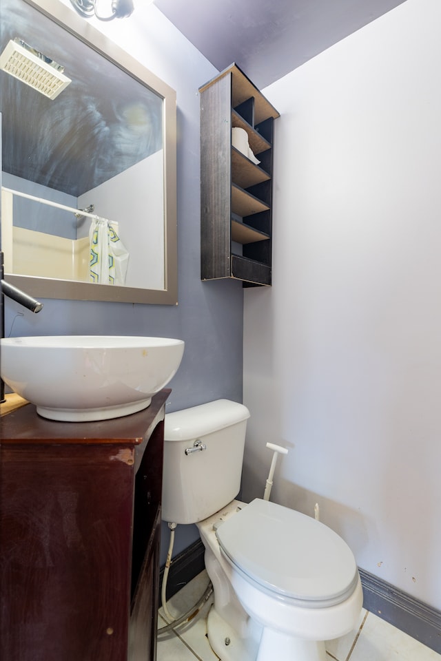 22273 Collette St, Woodhaven, MI 48183 - full bath with vanity, toilet, a shower with shower curtain, tile patterned floors, and baseboards