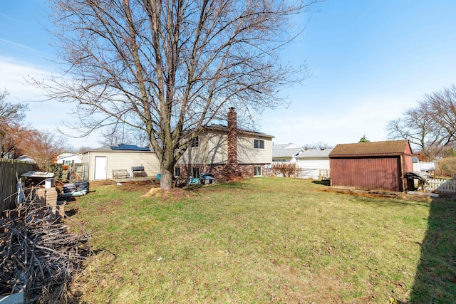 22273 Collette St, Woodhaven, MI 48183 - view of yard with an outbuilding, a shed, and fence