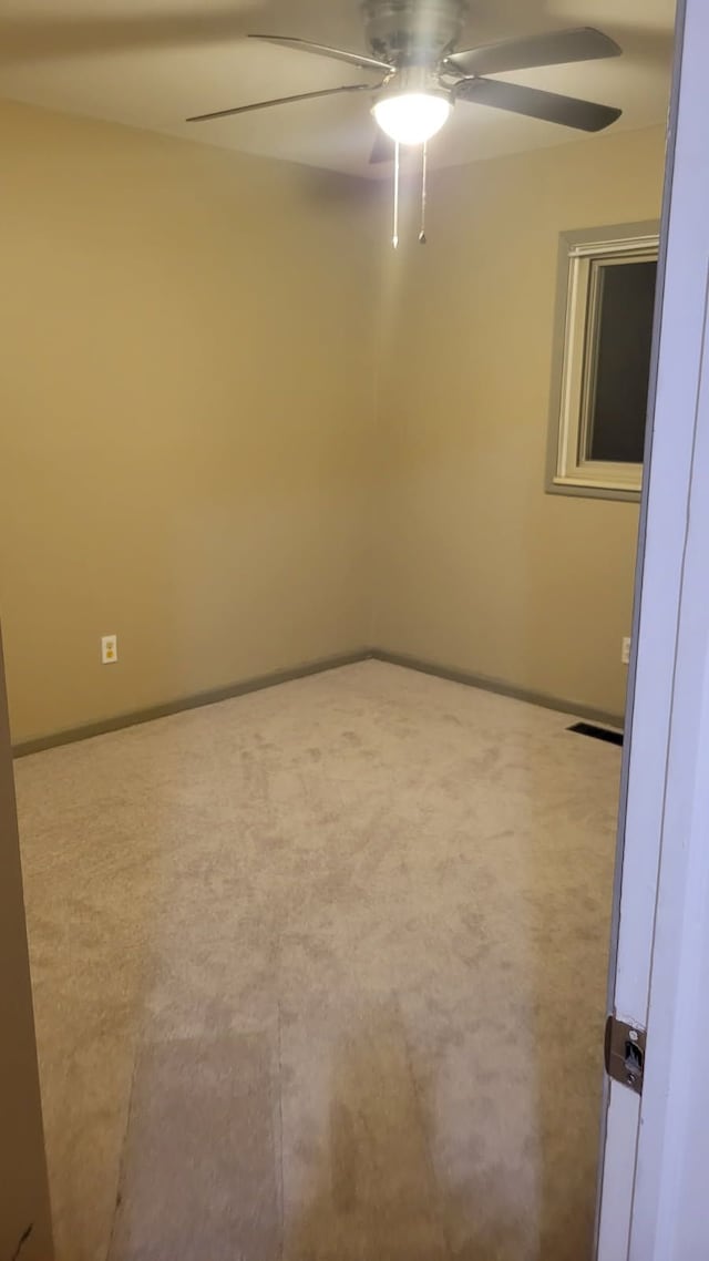22273 Collette St, Woodhaven, MI 48183 - empty room with ceiling fan and baseboards