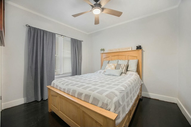 bedroom featuring dark wood-style floors, a ceiling fan, baseboards, and crown molding