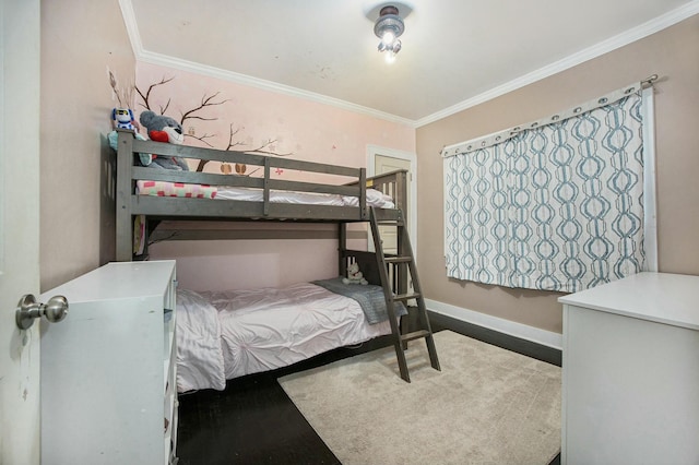 bedroom with crown molding and baseboards