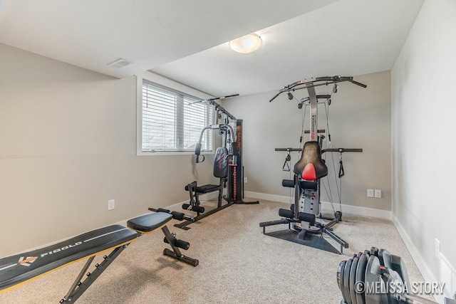 exercise area with carpet floors and baseboards