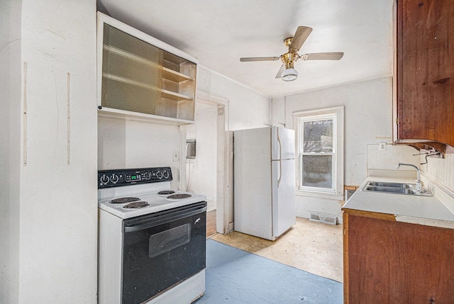 kitchen featuring ceiling fan, white appliances, a sink, visible vents, and light countertops