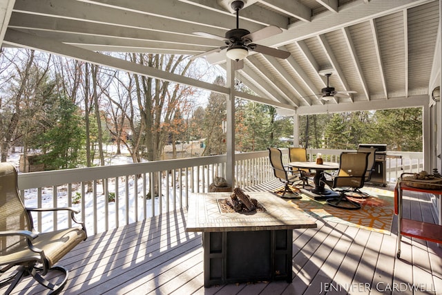 deck featuring ceiling fan and outdoor dining space